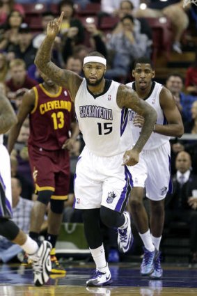 Sacramento Kings centre DeMarcus Cousins gestures after scoring against the Cleveland Cavaliers in Sacramento.