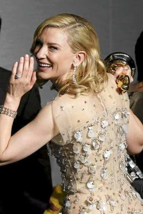 Great Oscars success ... Best actress winner Cate Blanchett looks back over her shoulder.