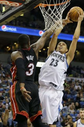 Minnesota Timberwolves guard Kevin Martin (23) is fouled by Miami Heat shooting guard Dwyane Wade (3) during the fourth quarter.