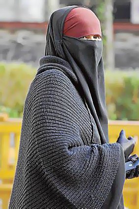 A woman wears a niqab in Lyon, eastern France.