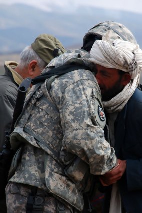 American Brigadier-General Michael Ryan consoles an Afghan man after the US Army killed 13 civilians in Herat province while targeting Taliban insurgents.