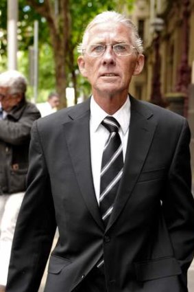 Doctor James Latham Peters leaving court after pleading guilty to 55 counts of infecting patients Hepatitis C while they were undergoing pregnancy terminations at Croydon Medical Clinic.