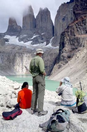 Hikers admire Torres del Paine's towers from a lookout.