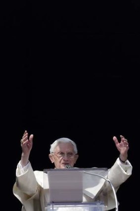 A change is coming ... Pope Benedict XVI waves as he leads the Sunday Angelus prayer in Saint Peter's Square.
