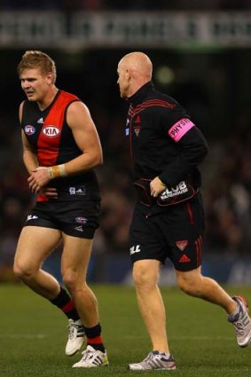 Michael Hurley comes from the ground with an injured wrist.