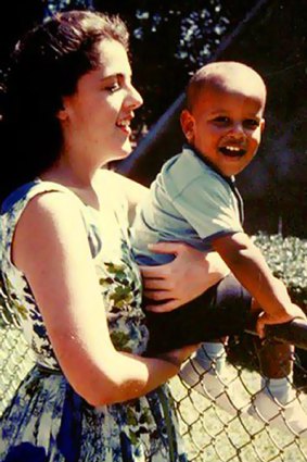 Mother Ann Dunham holds a young Barack Obama in the '60s.
