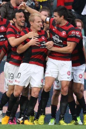 Centre of attention &#8230; Aaron Mooy celebrates.