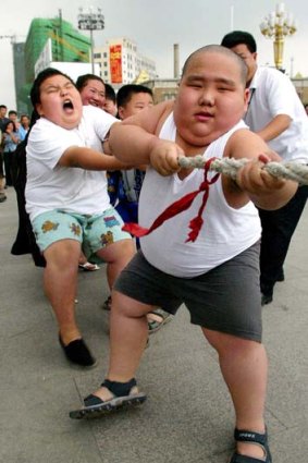 Rising tide of diabetes ... obese children participate in a tug-of-war at a boot camp in Shenyang, in northeastern China.