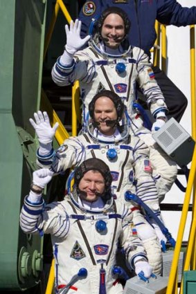 Before blast off ... US astronaut Kevin Ford (centre) and Russian cosmonauts Oleg Novitskiy (bottom) and Evgeny Tarelkin (top).