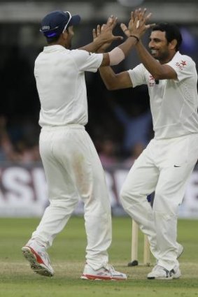 India's Mohammed Shami, right, celebrates with Ajinkya Rahane the wicket of England's Gary Ballance.