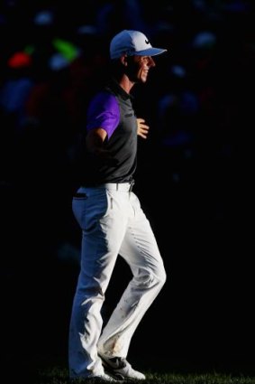 McIlroy salutes the crowd after he sank his final shot in the dark.