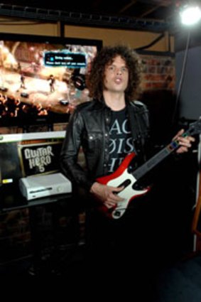 Coming to a living room near you...Woolfmother's Andrew Stockdale plays guitar Hero 5 at Enmore Hotel last month.