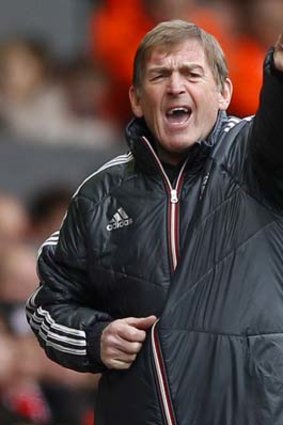 Liverpool's manager Kenny Dalglish instructs his team.