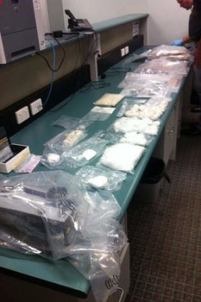 Police have seized almost half a million dollars cash and heroin worth $1.4m.