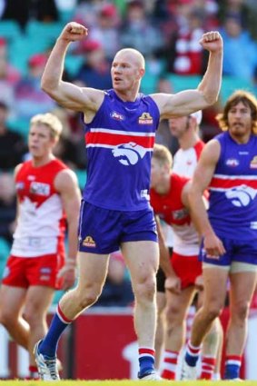 The Western Bulldogs' Barry Hall celebrates a goal against Sydney, one of his former sides, at the SCG.