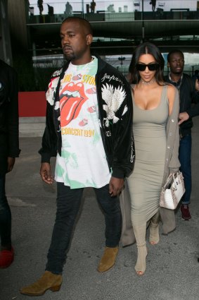 Kanye (with wife Kim Kardashian) in a Rolling Stones T-shirt in Paris in June.