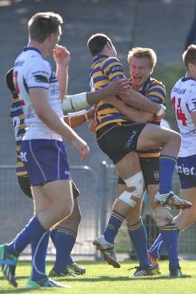 Middle ground:Tom Kingston celebrates after scoring a try in Sydney University's Shute Shield grand final win.