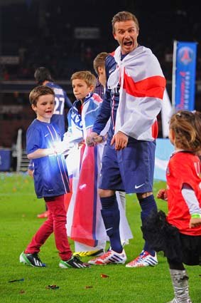 David Beckham does a lap of honour to mark his last game, with his sons, Brooklyn, Romeo and Cruz.