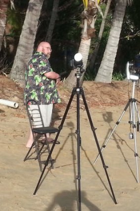 Amateur astronomer John Power prepares for the solar eclipse on Ellis beach in northern Queensland.
