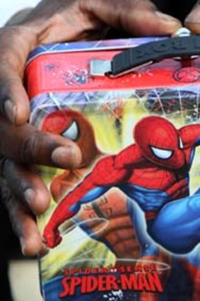 His tips jar, a spiderman lunchbox.
