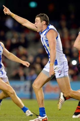 North Melbourne's Nathan Grima has reason to celebrate.
