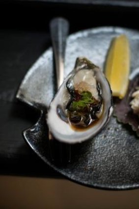 Coffin Bay oyster with fly fish pearls and negi, served at Hako.