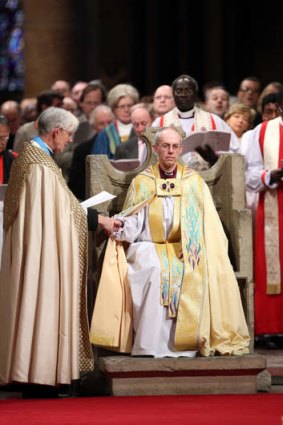 Justin Welby sits in the Chair of St Augustine   during his enthronement as the Archbishop of Canterbury.
