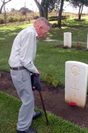 Wish fulfilled &#8230; Syd Riley visits his brother Vivien's resting place at the Bomana War Cemetery in 2009.