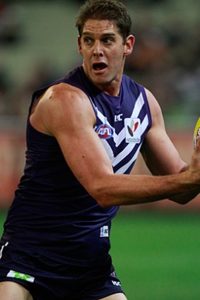 Aaron Sandilands requires surgery on his cheekbone after an incident in the first quarter of Fremantle's 95-point demolition of Melbourne on Sunday.