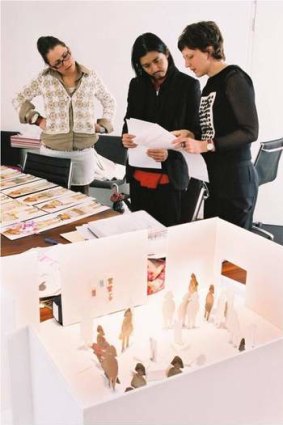 Katie Somerville with designer Akira Isogawa during preparations for an exhibition of his work at NGV.