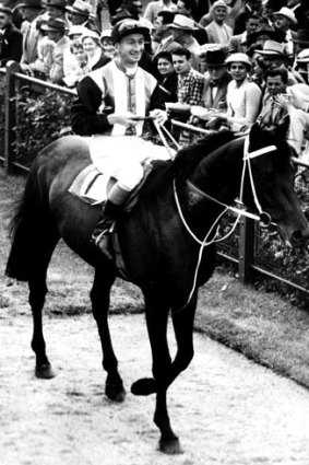 Astute &#8230; champion rider and punter George Moore with Tulloch on Victoria Derby day in 1957.