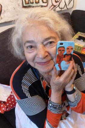 Artist Mirka Mora with the iPhone cover of her art.