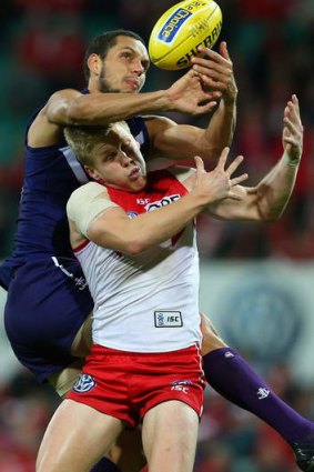 Ray of light: Daniel Hannebery, nominated by John Longmire as one of the Swans' best, contests the ball with Michael Johnson at the SCG.