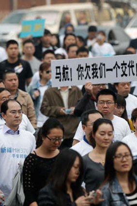 MH370 relatives march in Beijing.
