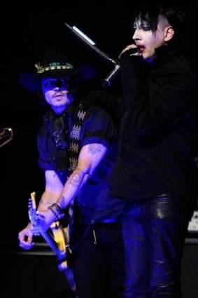 Johnny Depp performs with Marilyn Manson in Los Angeles in 2012.