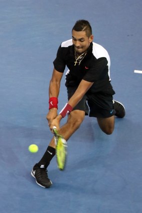 Nick Kyrgios plays a backhand in his tight loss to Feliciano Lopez.