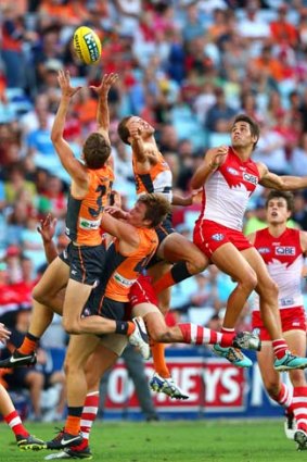 Giant mark: GWS youngster Will Hoskin-Elliott takes a fine grab against the Swans on Saturday.