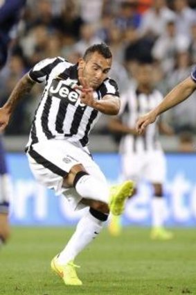 Carlos Tevez helped Juventus seal a win over Udinese.