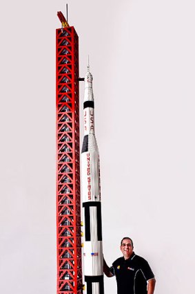Australia's only certified Lego professional, Ryan McNaught, stands next to the 5.6-metre tall Lego rocket.