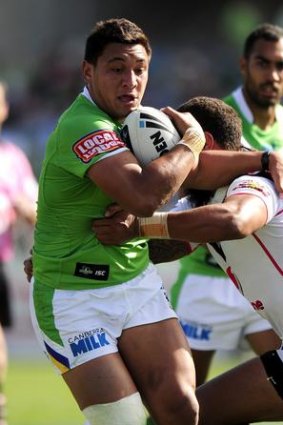 Canberra's Josh Papalii is tackled by New Zealand's Manu Vatuvei.