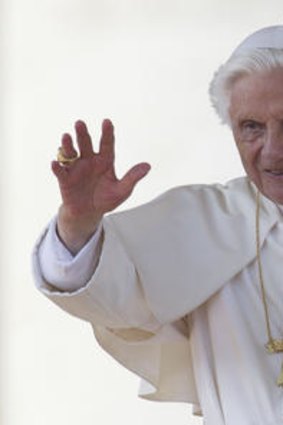 Pope Benedict XVI blesses the faithful in St. Peter's Square at the Vatican for his weekly general audience.