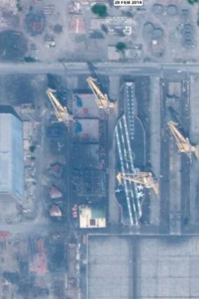 A satellite image  showing Iran's mock-up of a Nimitz-class aircraft carrier in one of its naval shipyards near Bandar Abbas.