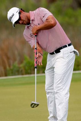 Adam Scott putts during a practice round for the PGA Championship.