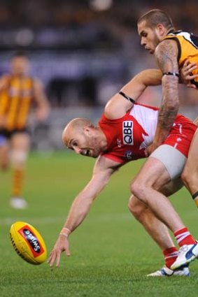Jarrad McVeigh and Lance Franklin scrap for the ball during the 2011 finals.
