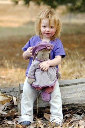 Mercedes Davies, 2, holds her most treasured possession, her doll, Mary.