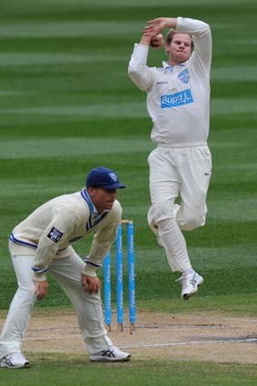 NSW spin bowler Steven Smith bowling at the MCG against Victoria.