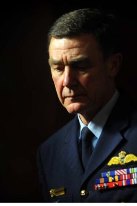 Chief of the Defence Force, Air Chief Marshal Angus Houston leaves a press conference after informing the media of the death of Sapper Jamie Larcombe.