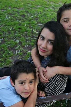 Bianca Maciel Pizzorno, with her sons Carlos (left) and Alessandro, feels lucky despite her battle to make ends meet.