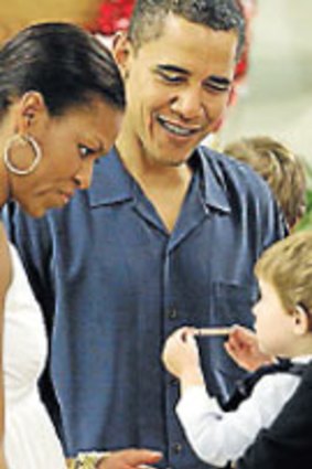 Hawaii holiday...the Obamas meet families at a Marine Corps base.