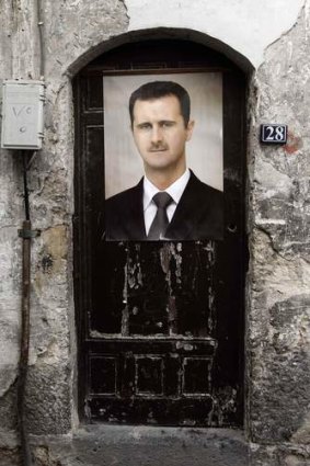 Syrian President Bashar al-Assad told American TV there was no evidence he had used chemical weapons. A portrait of Assad is affixed on a door in old Damascus.